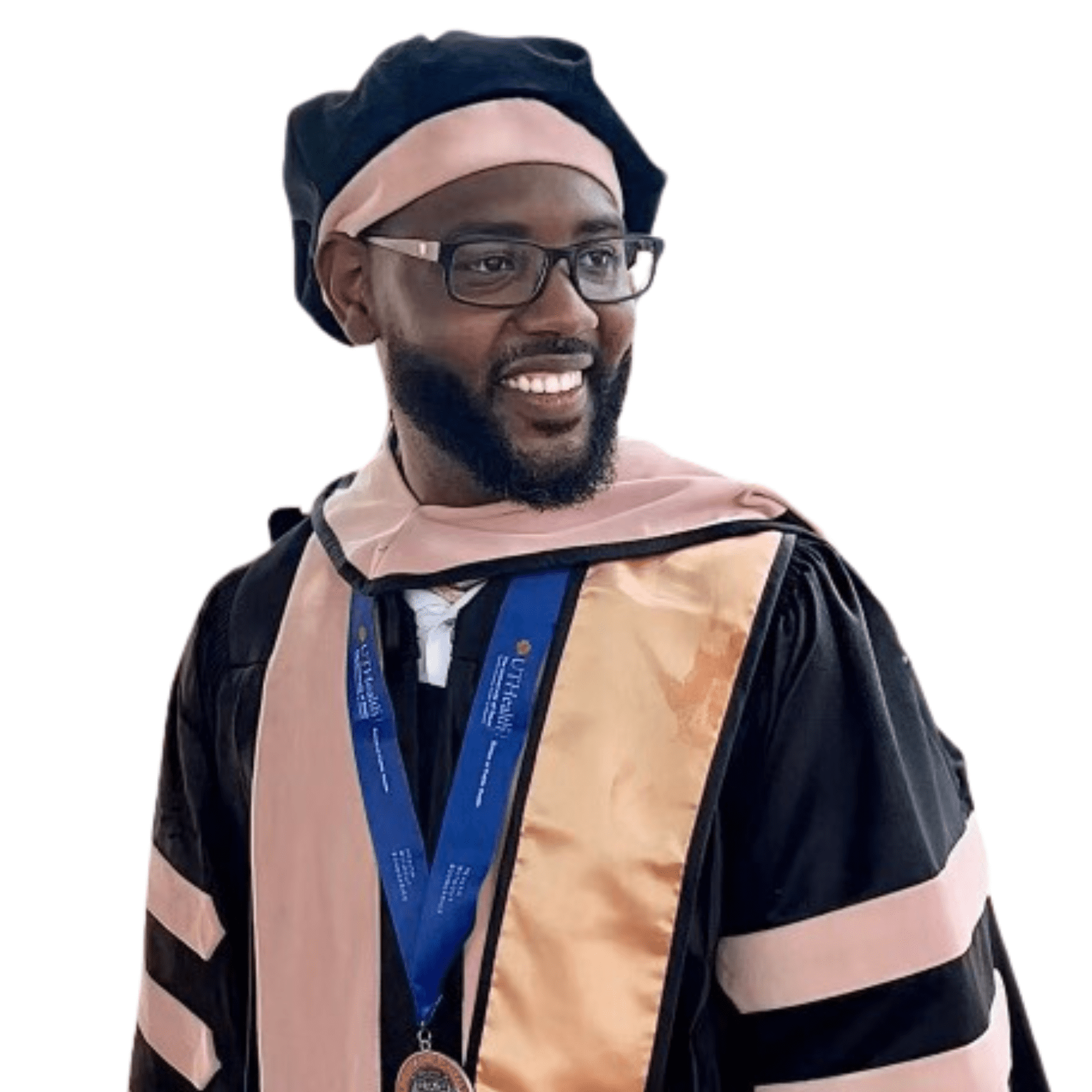 Dr. Anderson, Founder of Black Men in Public Health, in PhD robe. The robe is pink and black with a blue award around his neck.